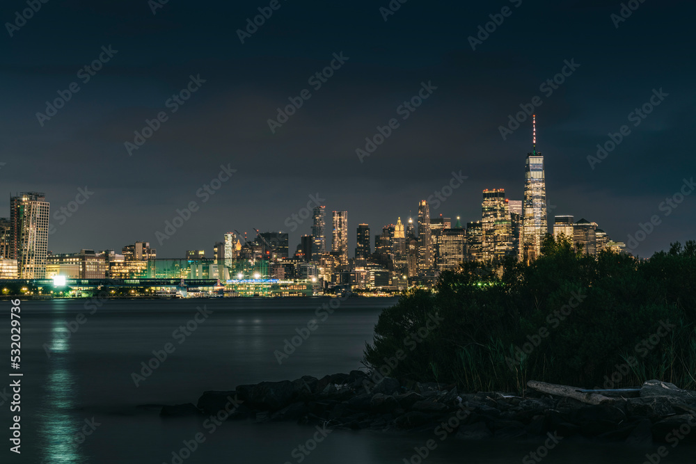 New York City skyline at night. View from Hudson river, New York, USA, America. . High-quality photo