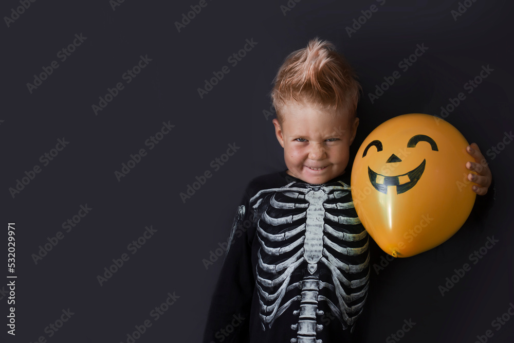 Happy halloween card with dressed boy over dark background Happy halloween card with dressed boy over dark background