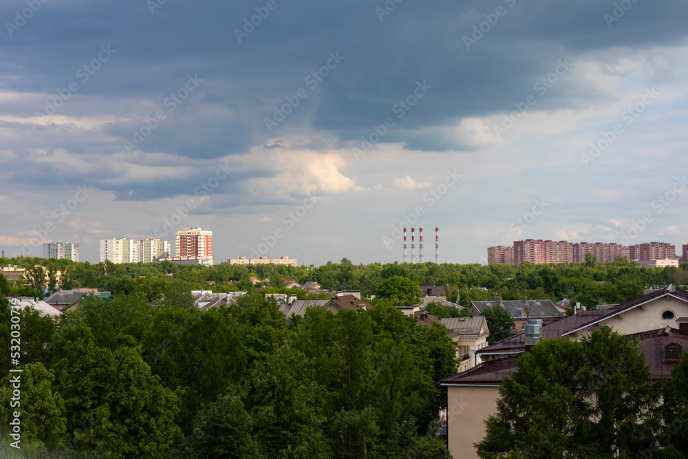 View of the city of Vidnoye, Moscow region Russia from the Ferris wheel in the city park. Shkolnaya Street, roofs of two-story residential buildings