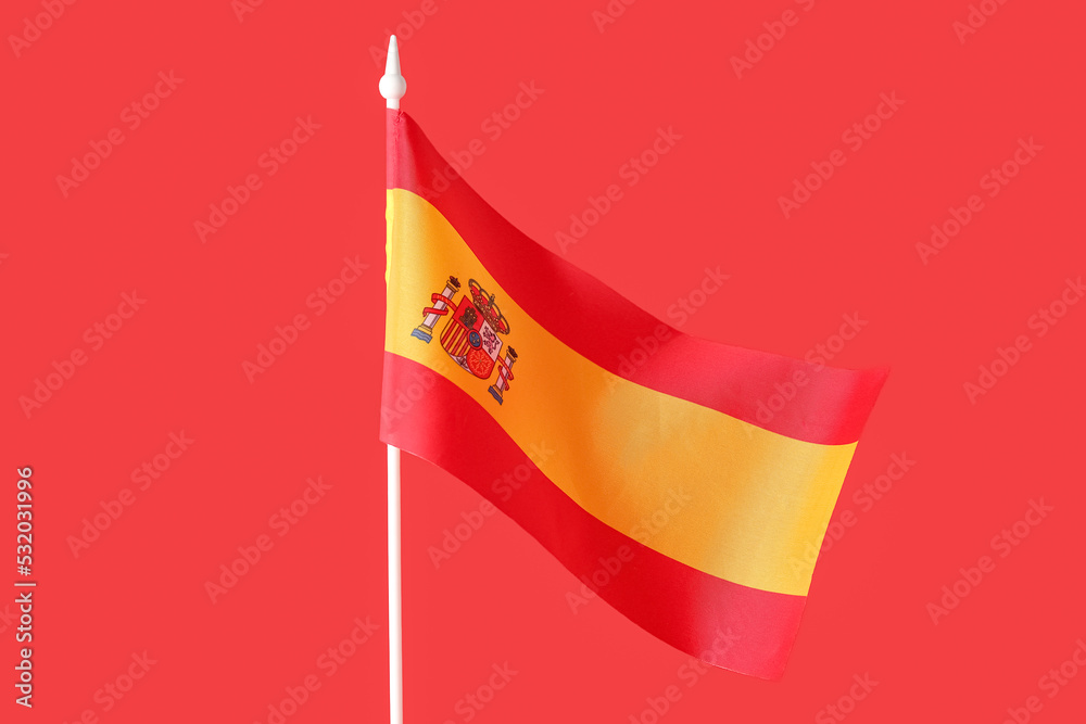 Naklejka premium National flag of Spain on red background