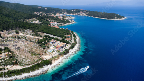 Drone view to boat in crystal pacific blue sea in Greece, on idyllic greek island in Ionian sea