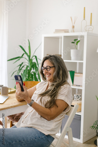 Lifestyle portrait of a businesswoman at home having a video call  © STUDIO TAURUS