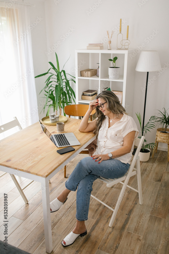 Caucasian woman working online from home Caucasian woman working online from home
