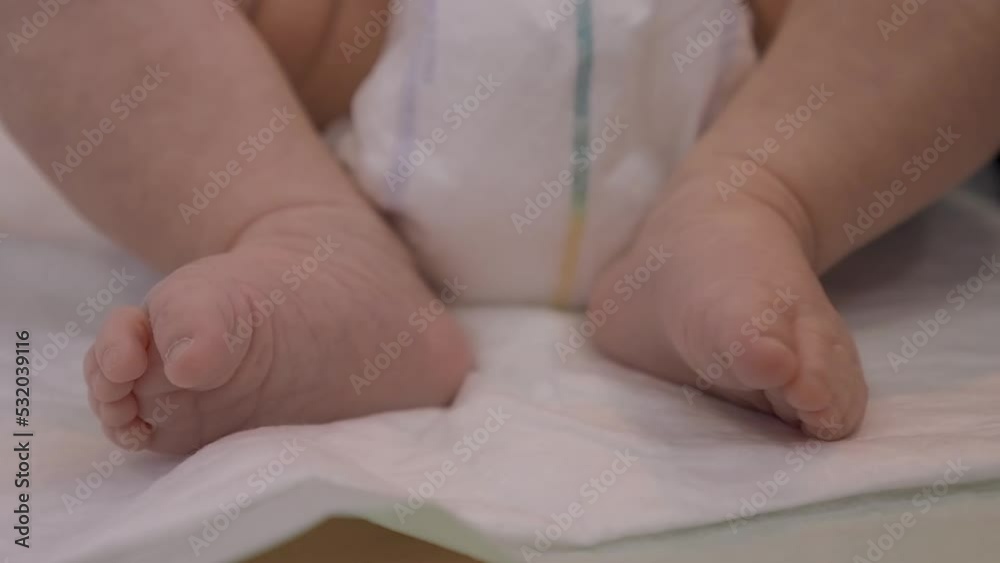 Little foot of a cute baby with selective focus. Adorable one month newborn girl Little foot of a cute baby with selective focus. Adorable one month newborn girl