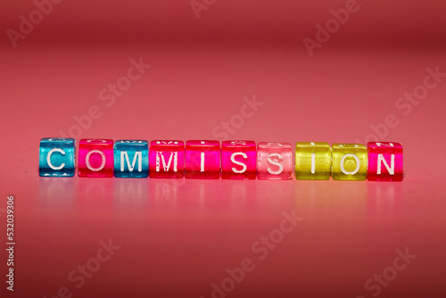 the word "commission" made up of cubes
