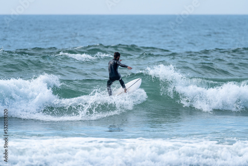 Surfer riding a wave © homydesign