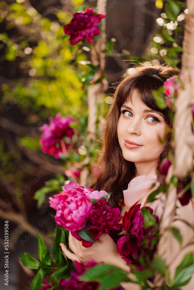 fabulous. a beautiful and gentle woman in peony flowers. feminine beauty. fabulous. a beautiful and gentle woman in peony flowers. feminine beauty.