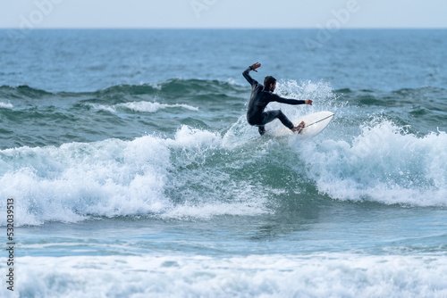 Surfer riding a wave © homydesign
