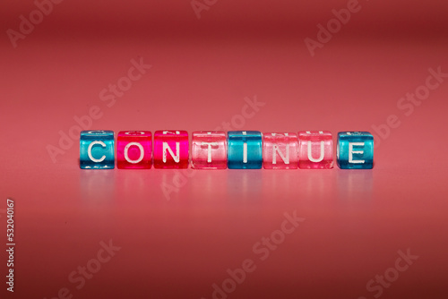 the word "continue" made up of cubes