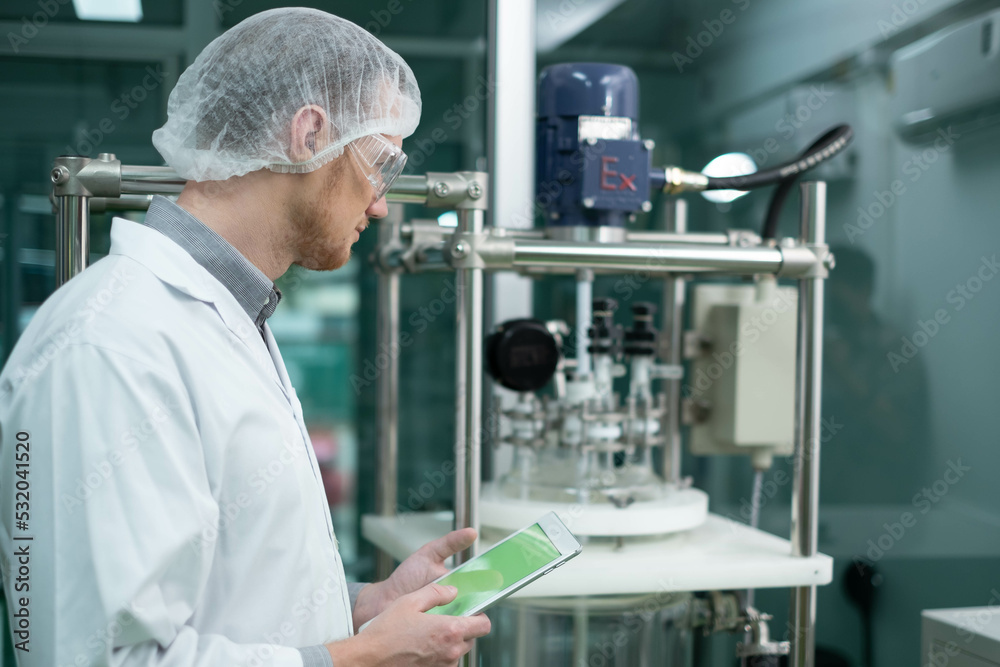 scientist in lab coat, researcher working in laboratory with cannabis oil CBD extraction machine, Chemical lab test on cannabis oil, CBD, THC, alternative medical. extract chemicals from cannabis.