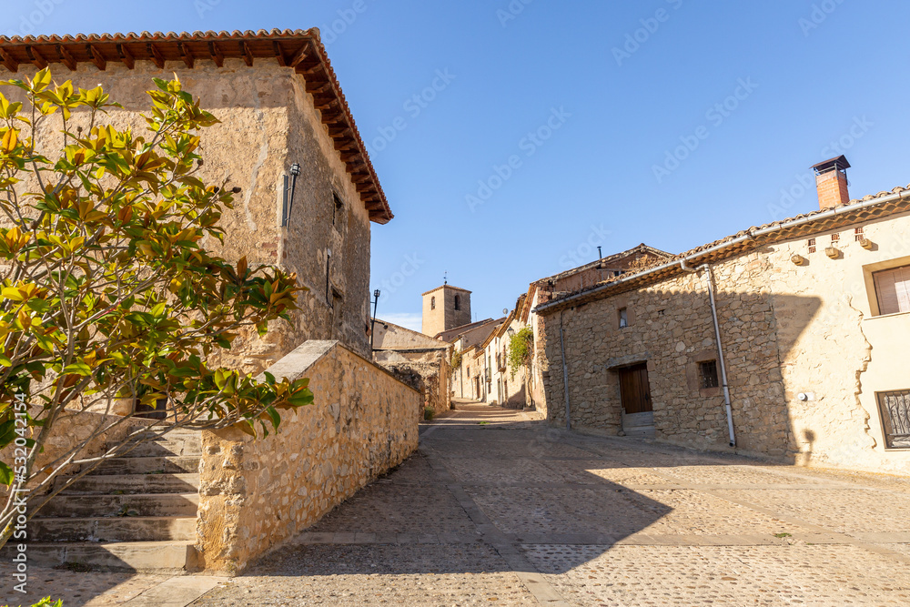a street with traditional houses in Caracena village, Tierras del Burgo, province of Soria, Castile and León, Spain
