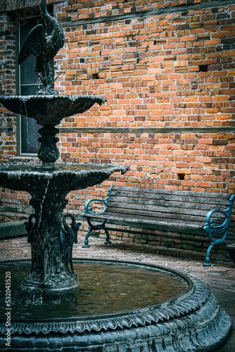 old water fountain beside bench - New Bern, NC