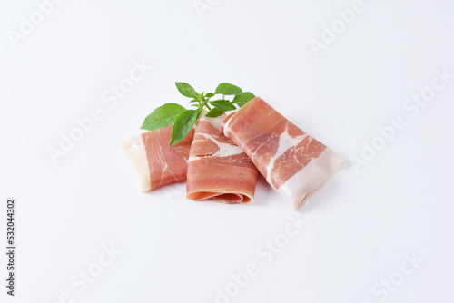 Italian prosciutto crudo or spanish jamon. Jerked meat, isolated on white background. 