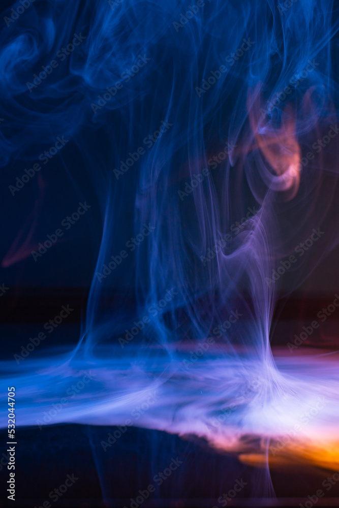 Real smoke exploding outwards, abstract blue fire gas smoke