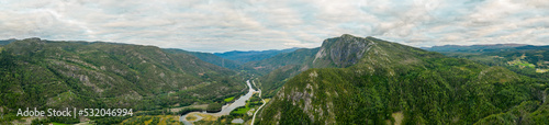 Aerial panorama mountains of Norway with river and scenic byway