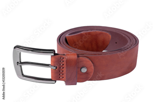 A rolled-up brown leather belt with a metal buckle on a white background is isolated.
