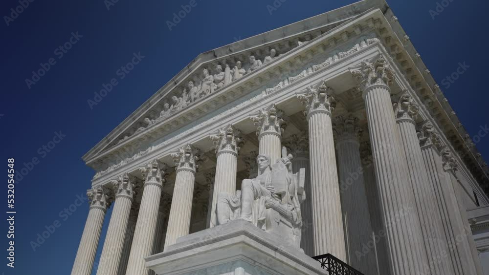 Turning view of facade of US Supreme Court building with Authority of Justice sculpture in front on a sunny summer evening. Turning view of facade of US Supreme Court building with Authority of Justice sculpture in front on a sunny summer evening.