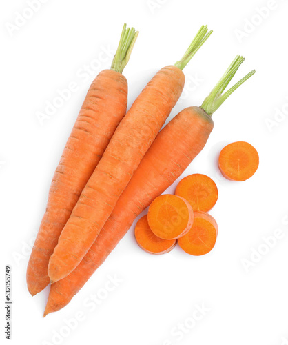 Tasty ripe organic carrots on white background, top view