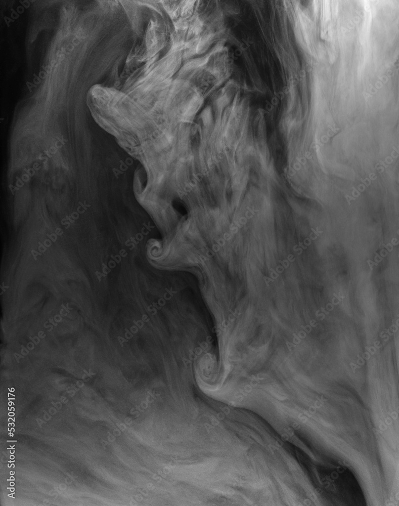 Fototapeta premium Swirling clouds of white smoke randomly mix on a black background