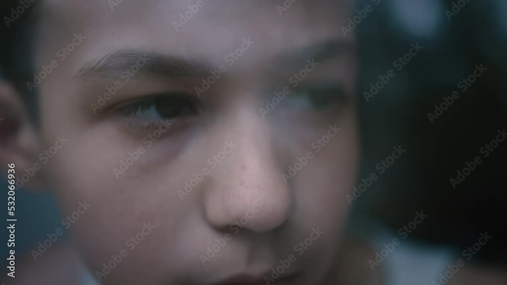 portrait of a sad boy near the window, leaned his head against the window and thinking about something, looks attentively out the window, misses someone portrait of a sad boy near the window, leaned his head against the window and thinking about something, looks attentively out the window, misses someone