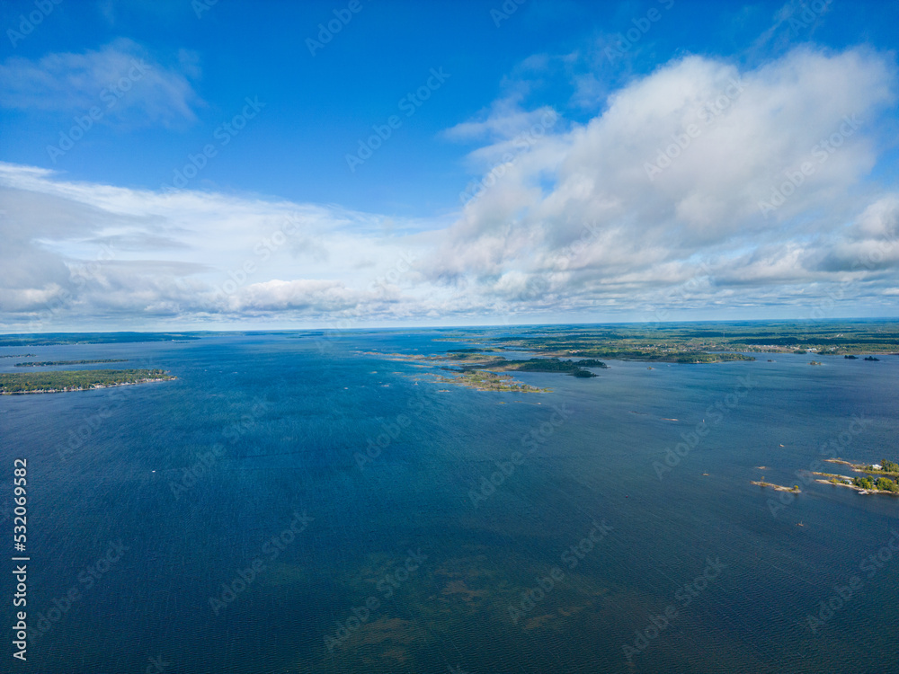 Lake Simcoe Ariel view blue sky blue water and white clouds and islands in view 