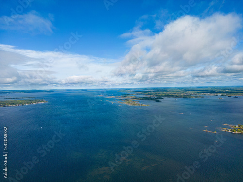 Lake Simcoe Ariel view blue sky blue water and white clouds and islands in view 