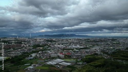 Aerial view of dramatic typhoon clouds over small coastal city photo