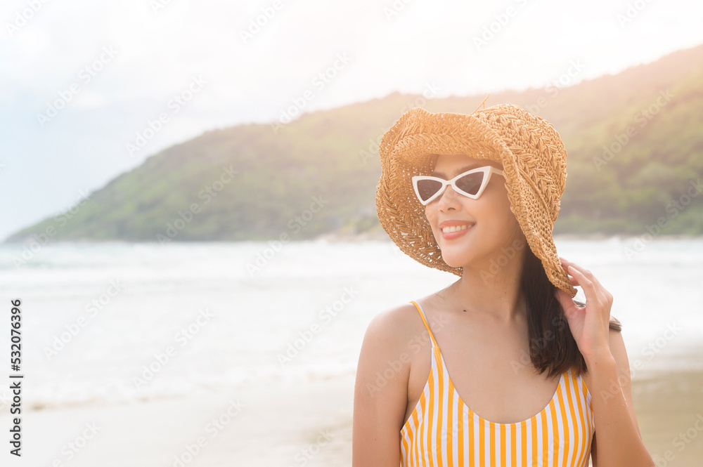 Young Beautiful woman in Bikini enjoying and relaxing on the beach,  Summer, vacation, holidays, Lifestyles concept.