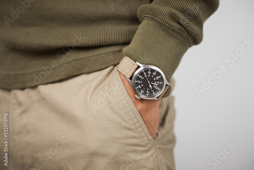 The man wearing wristwatch