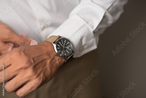 The man wearing wristwatch