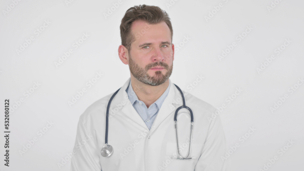 Middle Aged Doctor Showing No Sign by Head Shake, White Background Middle Aged Doctor Showing No Sign by Head Shake, White Background