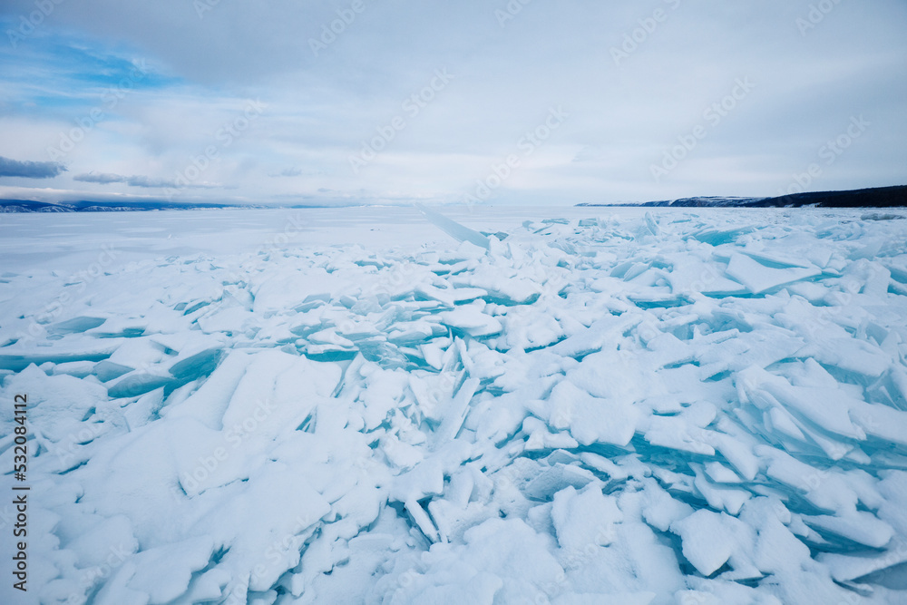 Turquoise ice floe. Winter landscape. Baikal lake