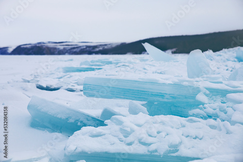 Turquoise ice floe. Winter landscape. Baikal lake