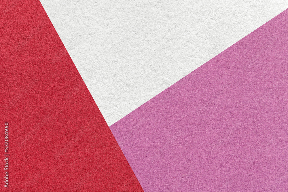 Fototapeta premium Texture of craft white, red and lilac color paper background, macro. Vintage wine abstract cardboard with gradient.