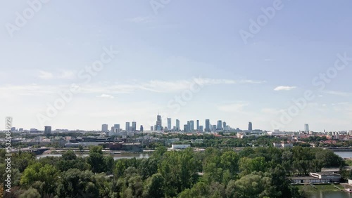 Warsaw aerial view over river and downtown skyline with skyscrapers, Panoramic cityscape of Warshawa city at summer day photo