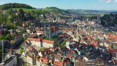 Aerial drone footage of the famous Saint Gallen historic old town with it famous Abbey of Saint Gall, now a cathedral, in Switzerland. Shot with a tilt down motion.  photo