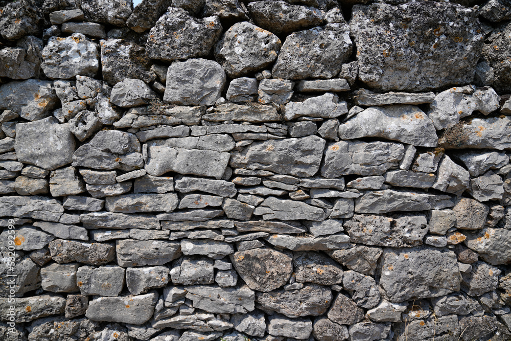 old grey ancient stones background vintage stone wall several shades of gray