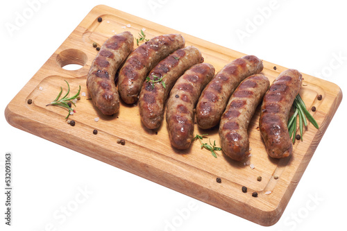 Grilled sausages on wooden cutting board
