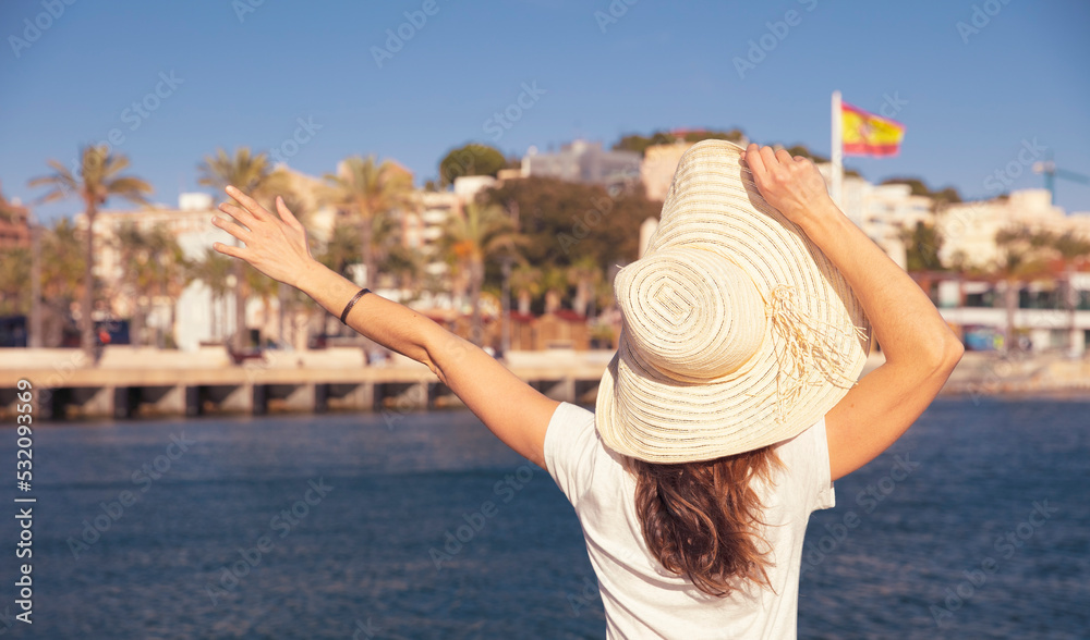 Rear view of woman tourist happy in Spain
