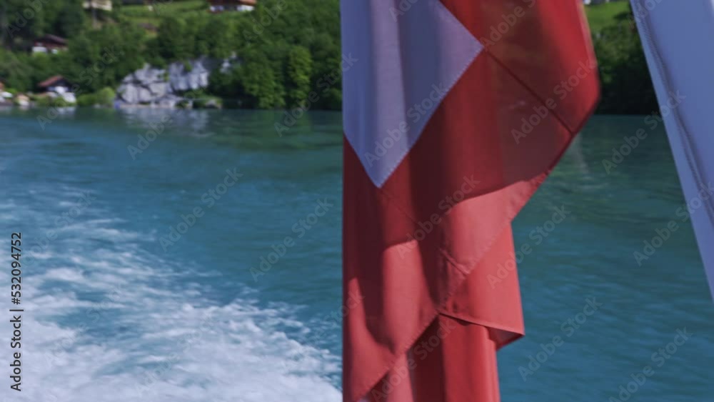Amazing View Boat Tour in Switzerland with Flag and Turquois Lake Amazing View Boat Tour in Switzerland with Flag and Turquois Lake