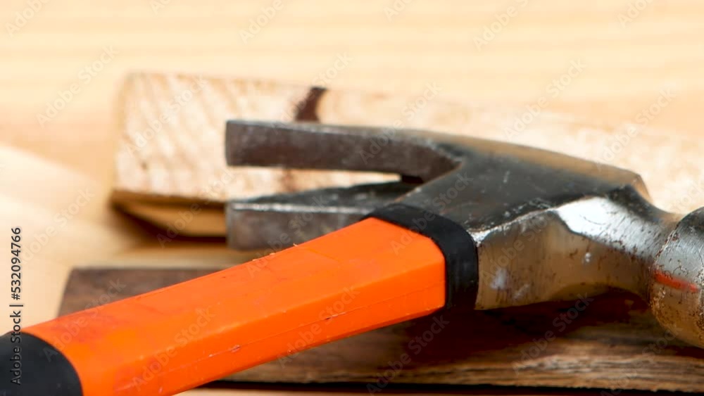 Slow side shot of hammer and pieces of wood. Slow side shot of hammer and pieces of wood.