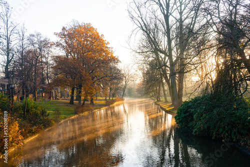 Minnewater lake , Minnewaterbrug . Beautiful lake and garden in old town of Brugge during autumn , winter : Brugge , Belgium : November 30 , 2019 photo