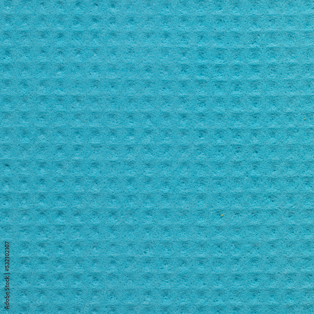 Blue porous sponge. Sponge texture. Cellular structure. Stock Photo