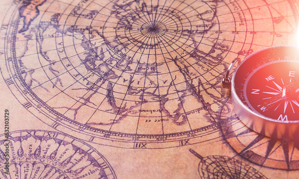 Obraz premium Looking for adventure. Compass and maps. Treasure map and path to the treasure.