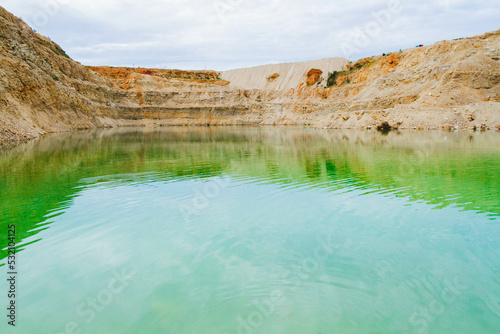 Lake formation in an old abandoned quarry. Termination of mining operations.