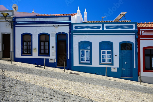 Fototapeta Naklejka Na Ścianę i Meble -  Lagos, Faro district, Algarve, Portugal, Europe - Porta da Vila street in historic part of the city, cute historic fishers houses - presently tourist rooms for rent 