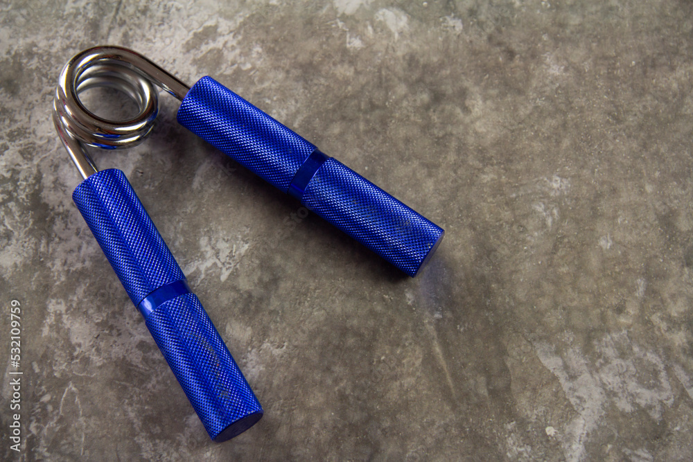 Hand grip. Hand grip trainer for sports activities Hand grip. Hand grip trainer for sports activities