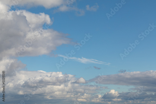 Picturesque blue sky with white clouds. Change of weather. Sky after the rain.