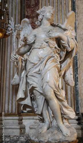 White Marble Angel with Lilies Statue at the Sant'Ignazio di Loyola Church in Rome, Italy