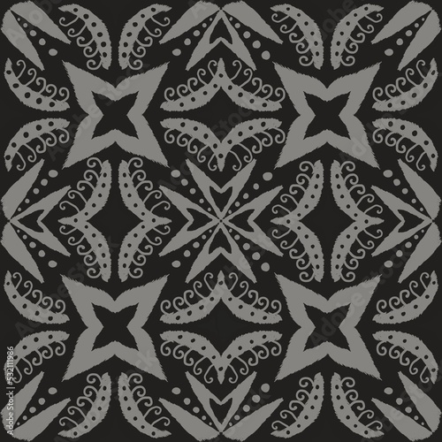 Monochrome ethnic ikat floral pattern. Illustration abstract floral monochrome grey ikat seamless pattern background. Ikat folk art pattern. Use for fabric  interior decoration elements  wrapping.